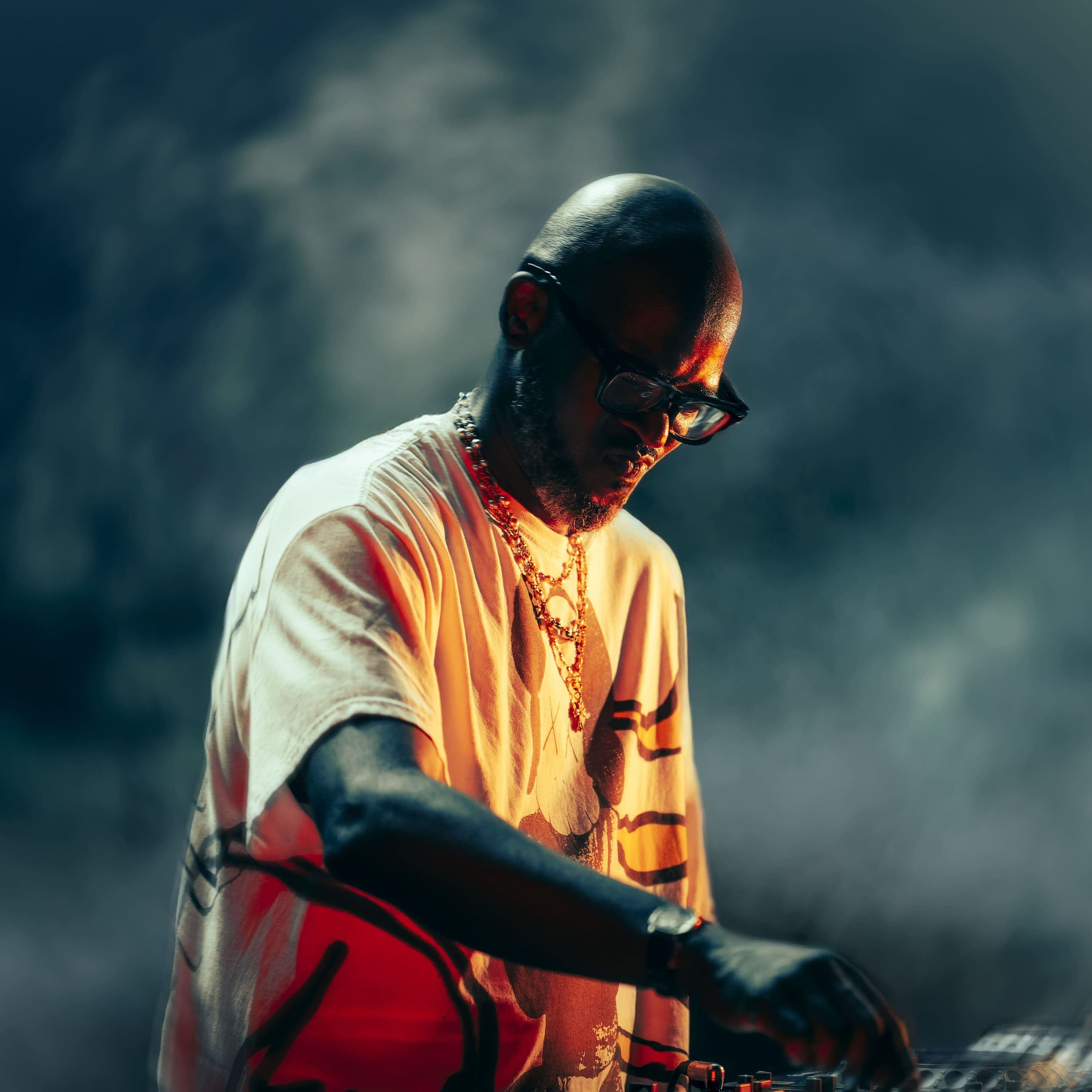 Black Coffee performing a DJ set during an immersive electronic music event at UNVRS Ibiza