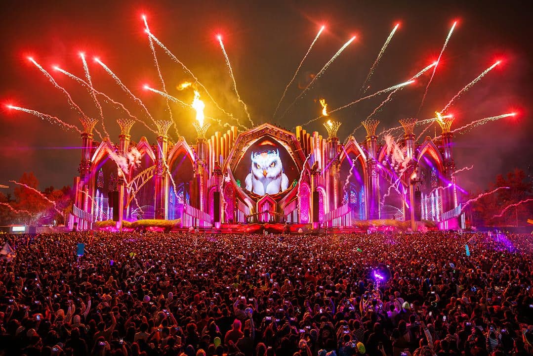 Massive crowd and mainstage fireworks at EDC Mexico during a nighttime electronic music festival in Mexico City